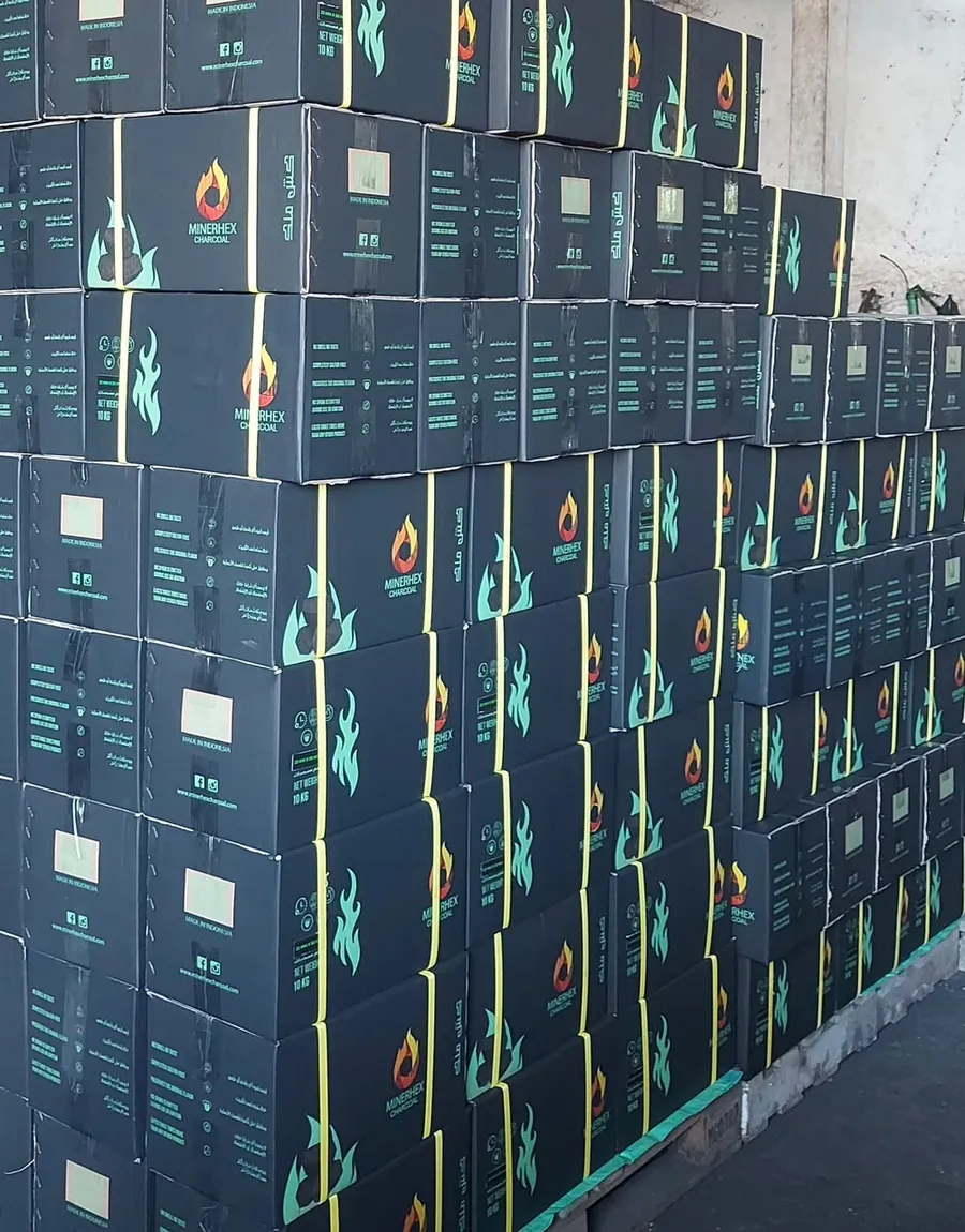 Pallets of Minerhex charcoal boxes stacked for shipment